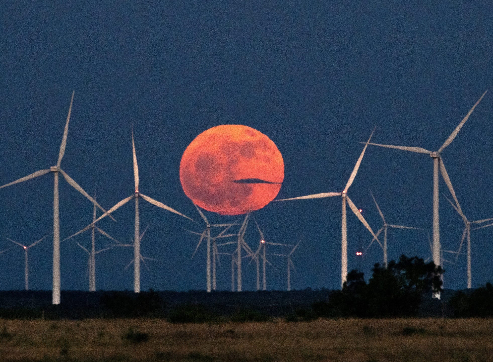 Wind turbines and solar farms face hurdles and win allies across US