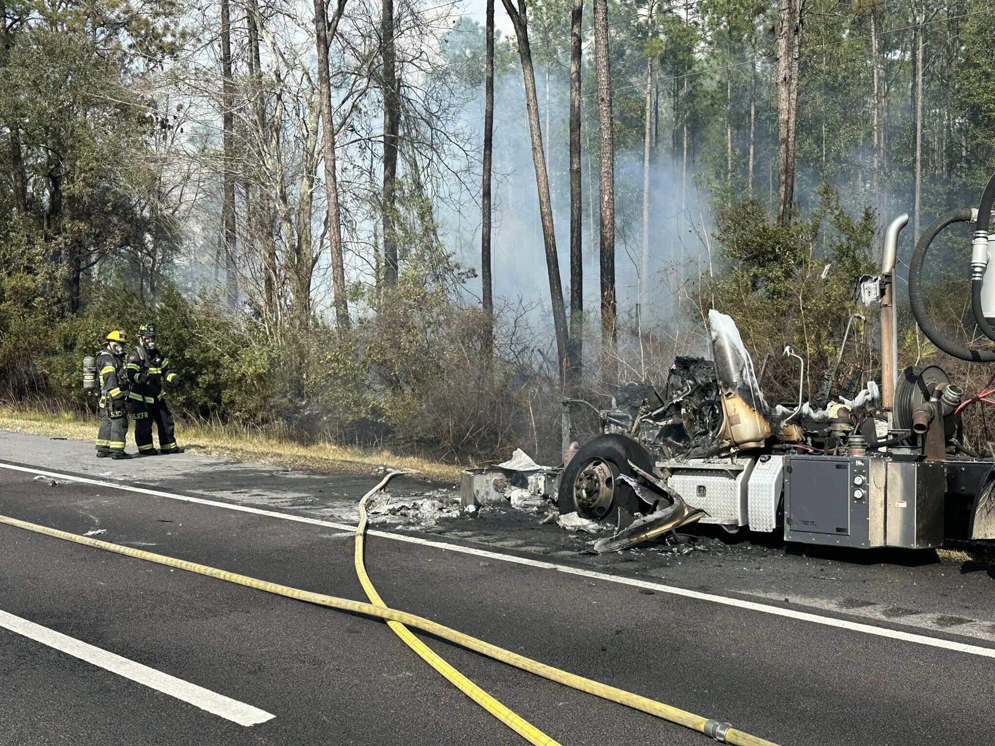 A semi-truck fire on I-95 sparked a brush fire in St. Johns County