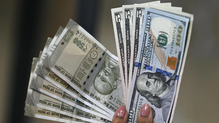 Rupee declines 27 paise to 90.95 against US dollar in early trade