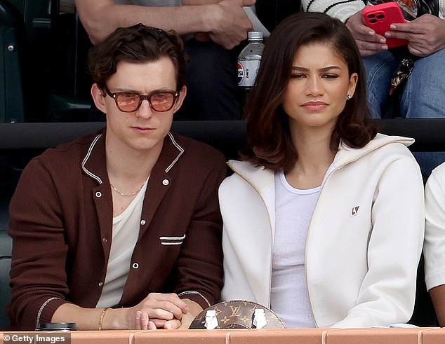 Zendaya appears to hint she's married Tom Holland as she flashes gold band  on her wedding finger