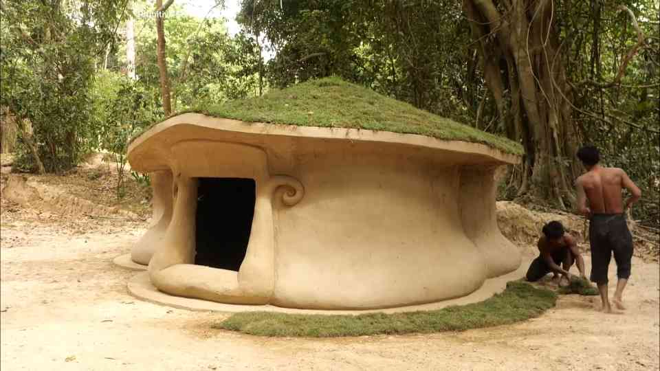 They shaped mud walls for days, then the grass roof had to be redone