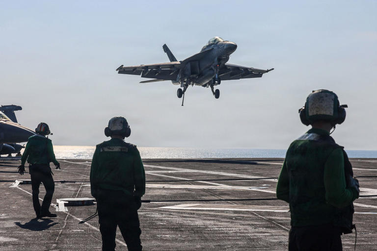 An image provided by the U.S. Navy shows the flight deck of the USS Abraham Lincoln, in the Arabian Sea.