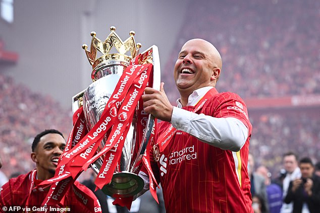 Slot celebrates with the Premier League title, won by 10 points in his first season at Anfield