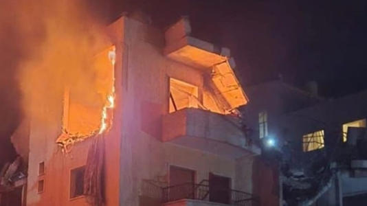 A burning building in the Bekaa Valley after the Israeli strikes. Pic: Al-Manar TV