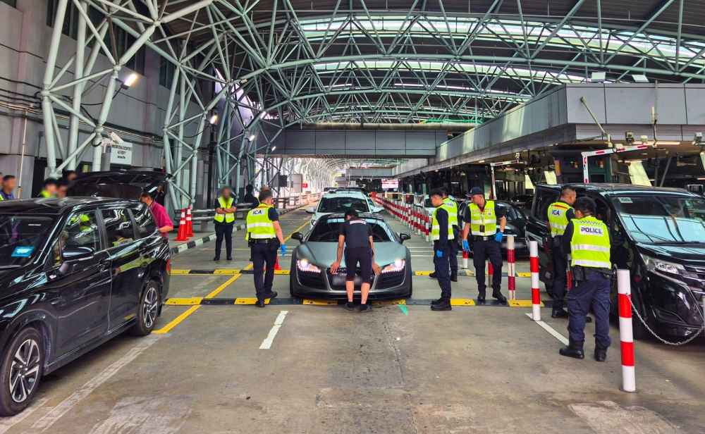 Queue jumpers and lane-crossers face penalties for Woodlands traffic ...