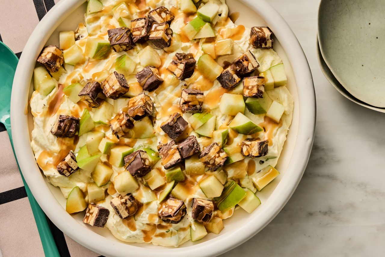 Snickers Salad in a white bowl to serve