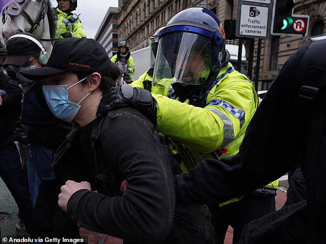 Police arrest six as violence breaks out between far-right Britain ...