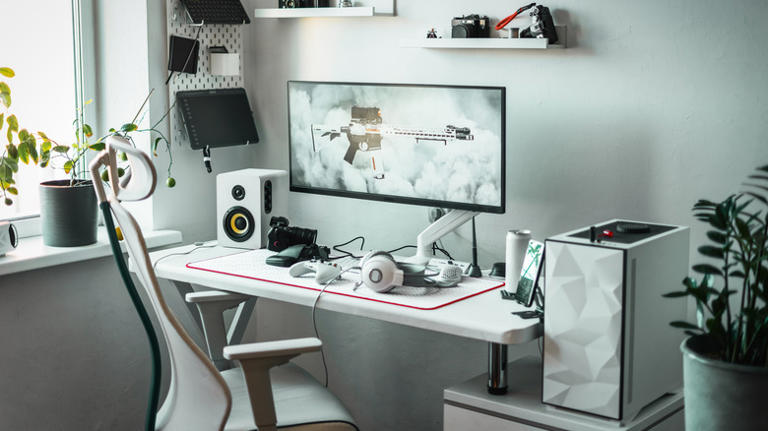 A clean computer setup featuting an ultrawide monitor.