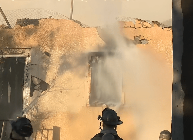 Fire burns through roof of vacant home in University Heights