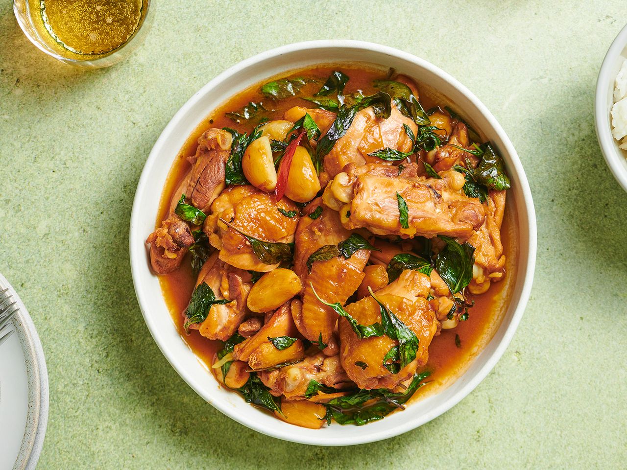Three cup chicken in a white ceramic bowl.