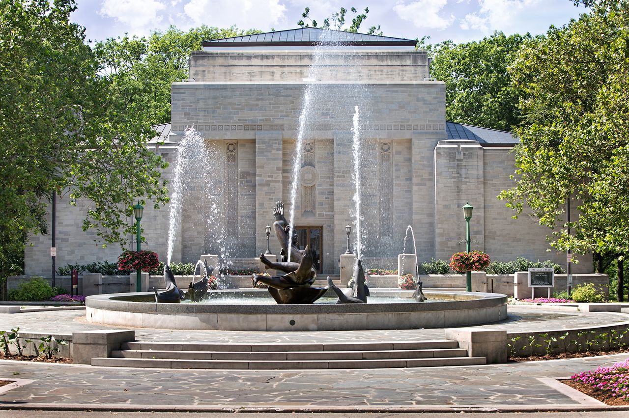 Lilly Library building in Bloomington Indiana with a decorative fountain in the foreground
