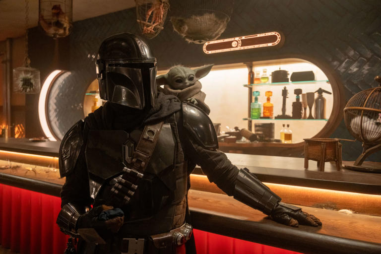 Mandalorian (Pedro Pascal), left, and Grogu in "The Mandalorian and Grogu."