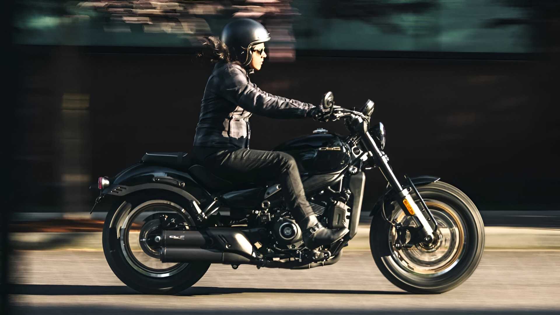 2026 CFMoto 450CL-C in black accelerating hard side profile view