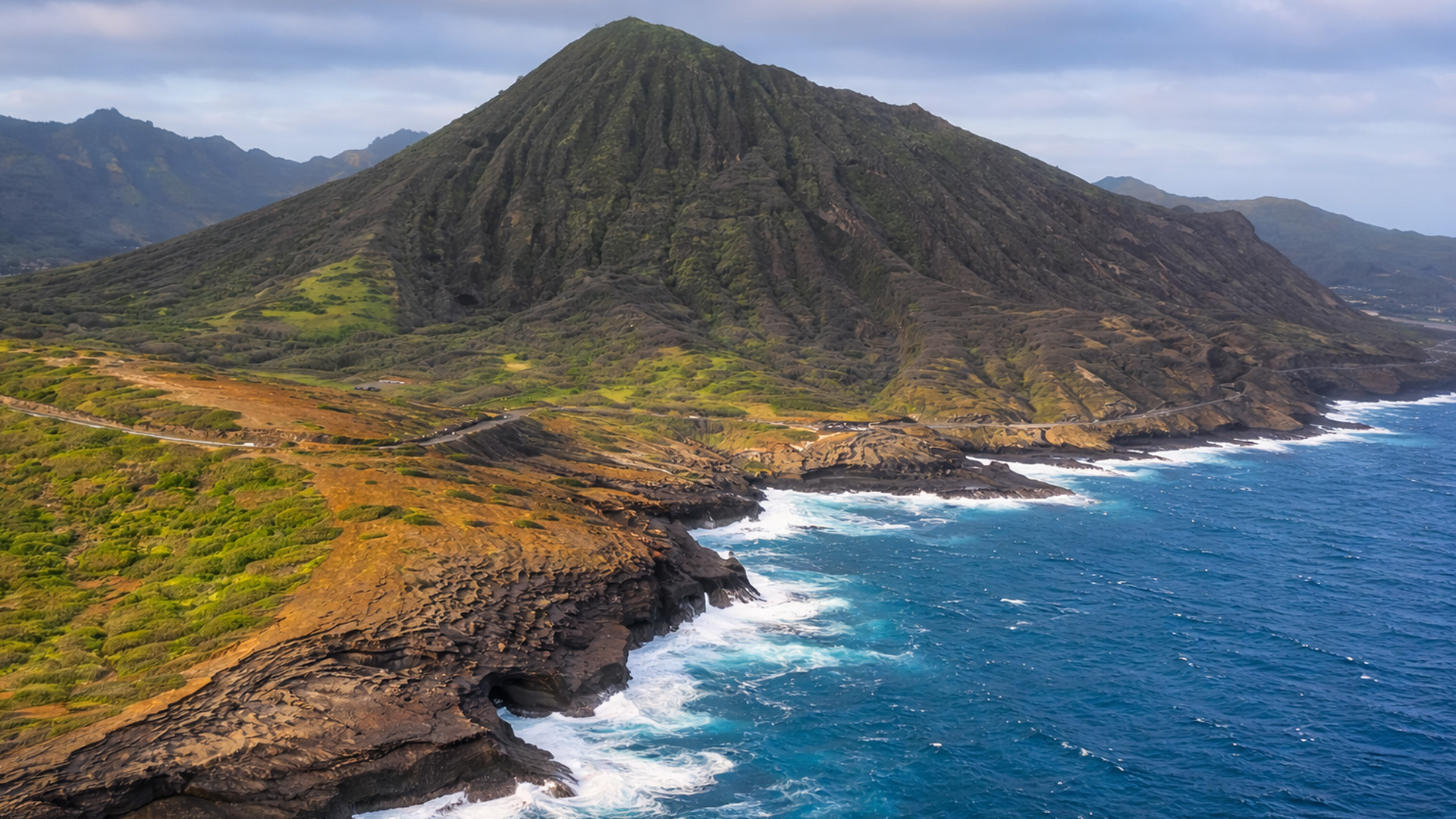 An island edge carved by fire and waves