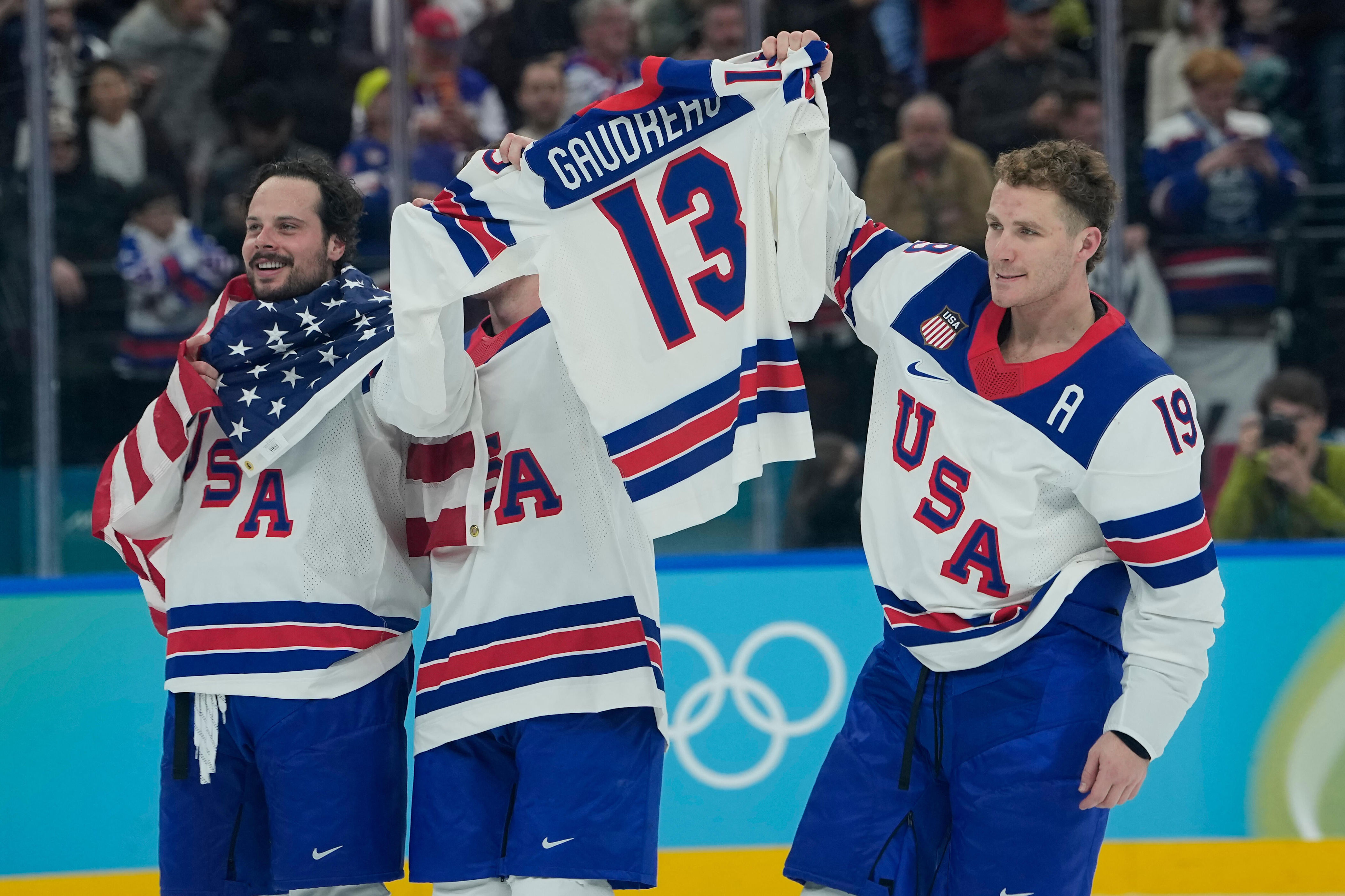 United States' Matthew Tkachuk (19), right, celebrates after the United States defeated Canada in a men's ice hockey gold medal game between Canada and the United States at the 2026 Winter Olympics, in Milan, Italy, Sunday, Feb. 22, 2026. (AP Photo/Petr David Josek) / Credit: AP Photo/Petr David Josek