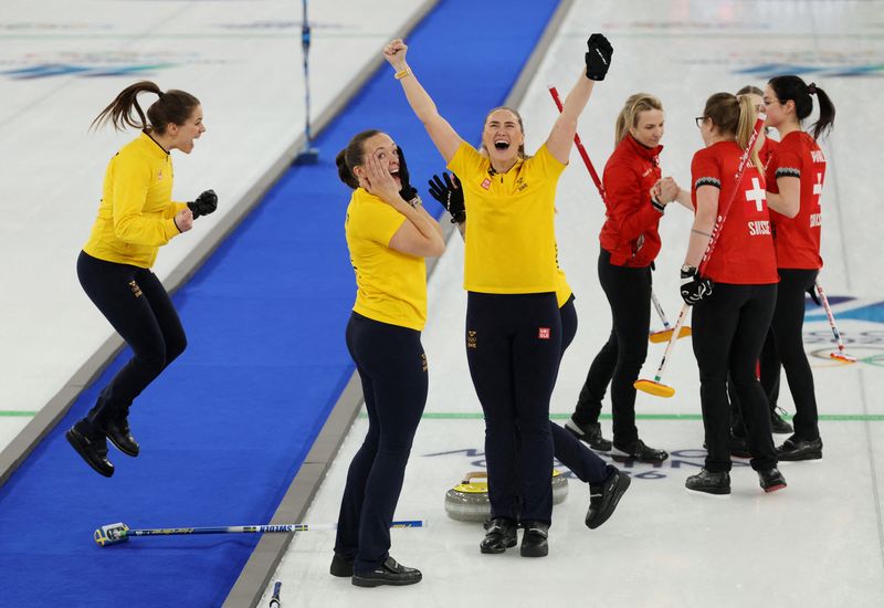 Milano Cortina 2026 Olympics - Curling - Women's Gold Medal Game - Switzerland vs Sweden - Cortina Curling Olympic Stadium, Cortina d'Ampezzo, Italy - February 22, 2026. Sara McManus of Sweden, Anna Hasselborg of Sweden and Agnes Knochenhauer of Sweden celebrate winning gold in the Women's Curling REUTERS/Issei Kato   TPX IMAGES OF THE DAY