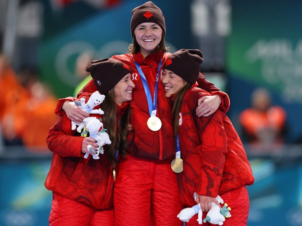  Gold medalists Ivanie Blondin, Valerie Maltais and Isabelle Weidemann of Team Canada celebrate on the podium during the medal ceremony for the women’s speed skating team pursuit.
