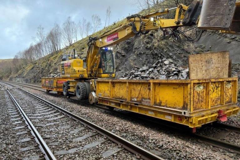 Trains delayed and cancelled after wall collapses onto stretch of ...