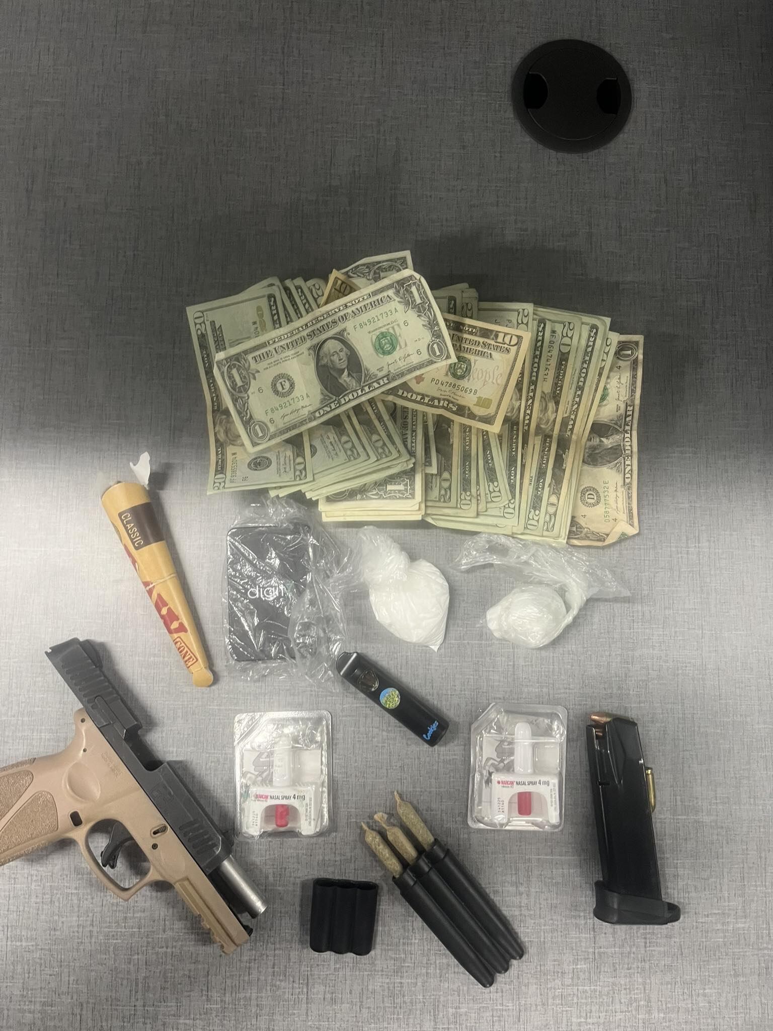 Two arrested after police recover stolen gun, drugs after responding to ...