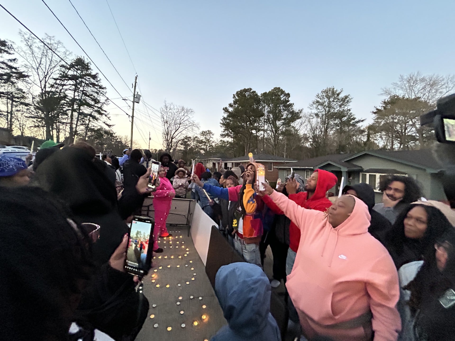 ‘It still hurts’: Family, friends hold candlelight vigil for USPS ...