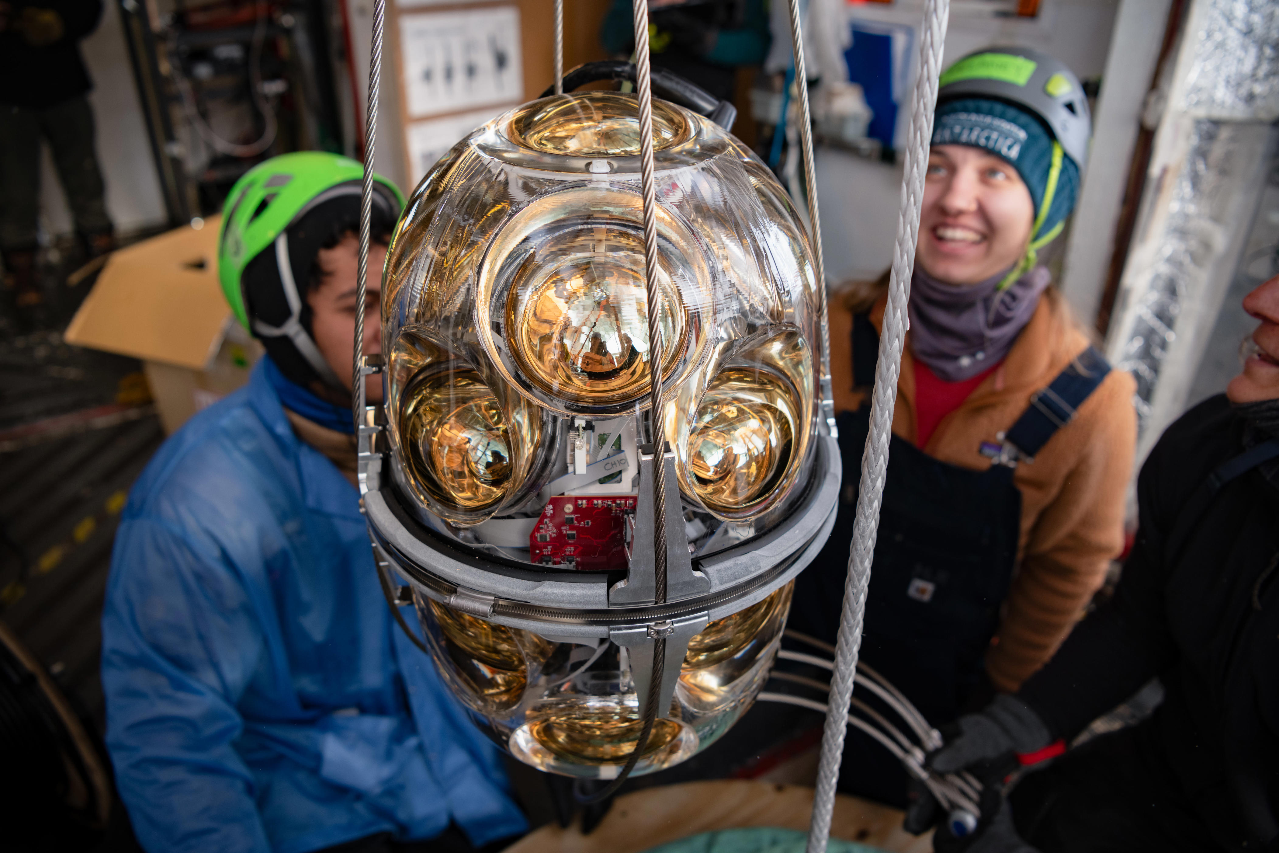 A long optical module with 18 photomultiplier tubes is prepared for installation at IceCube. (Yuya Makino/IceCube/National Science Foundation)