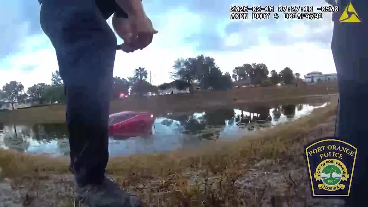 Officers rescue elderly driver from submerged vehicle