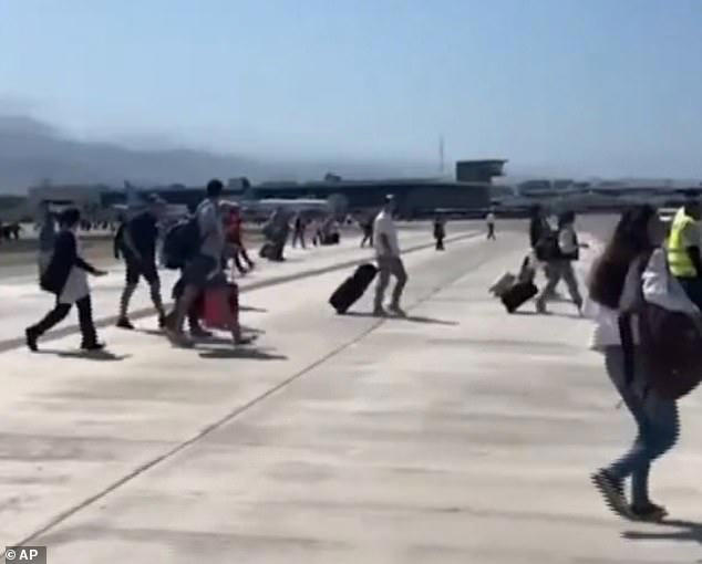 Terror in the terminal: Panicking tourists sprint through Mexican ...