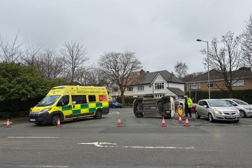 Car flips on busy road causing traffic queues