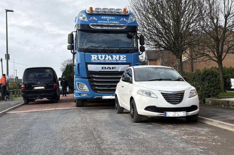 Four-hour 'Mexican stand-off' in Wigan as cars block lorries heading to ...