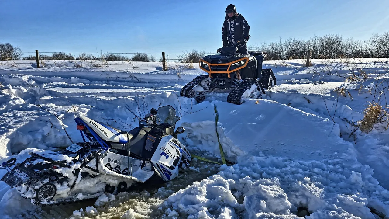 Rescuing smashed and sunk snowmobiles with electric Outlander
