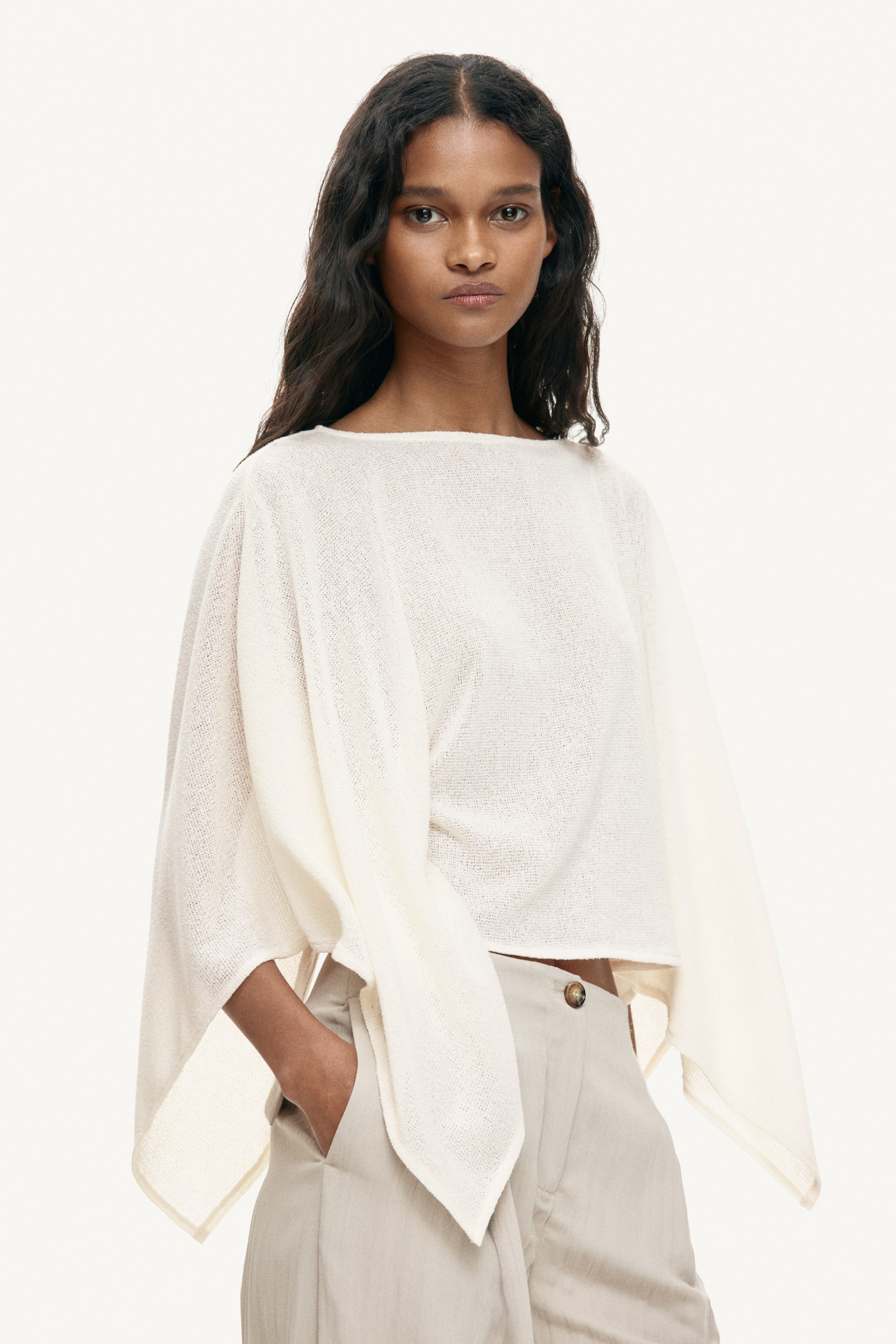 Expect every elegant dresser to be wearing a cape blouse this spring