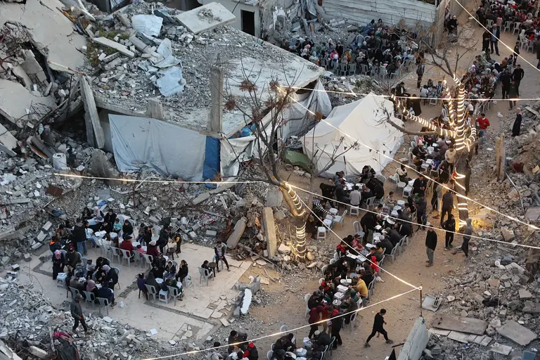 Ramadan in Gaza: Palestinians break fast among rubble of destroyed homes