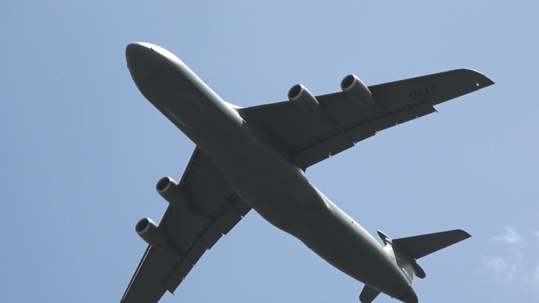 A 222-foot wingspan creating its own weather at rotation