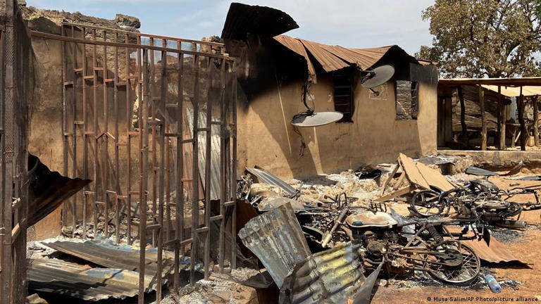 Extremists set fire to vehicles and homes during an attack on Woro, Kwara State, February 5