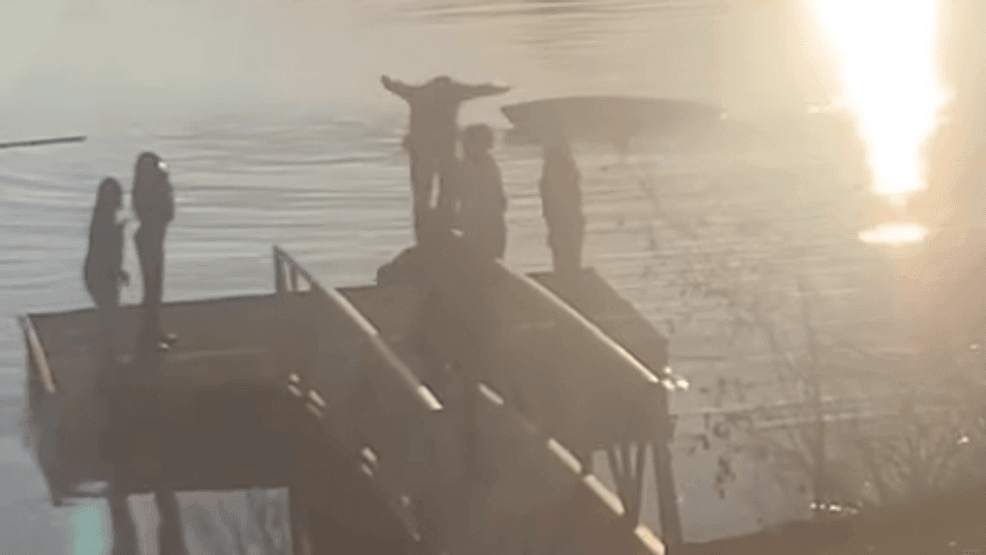 Video: Policeman dives into lake to rescue woman in the water