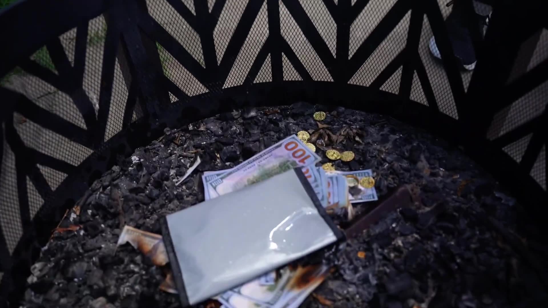 Testing fire-resistant pouch's ability to protect large currency amounts