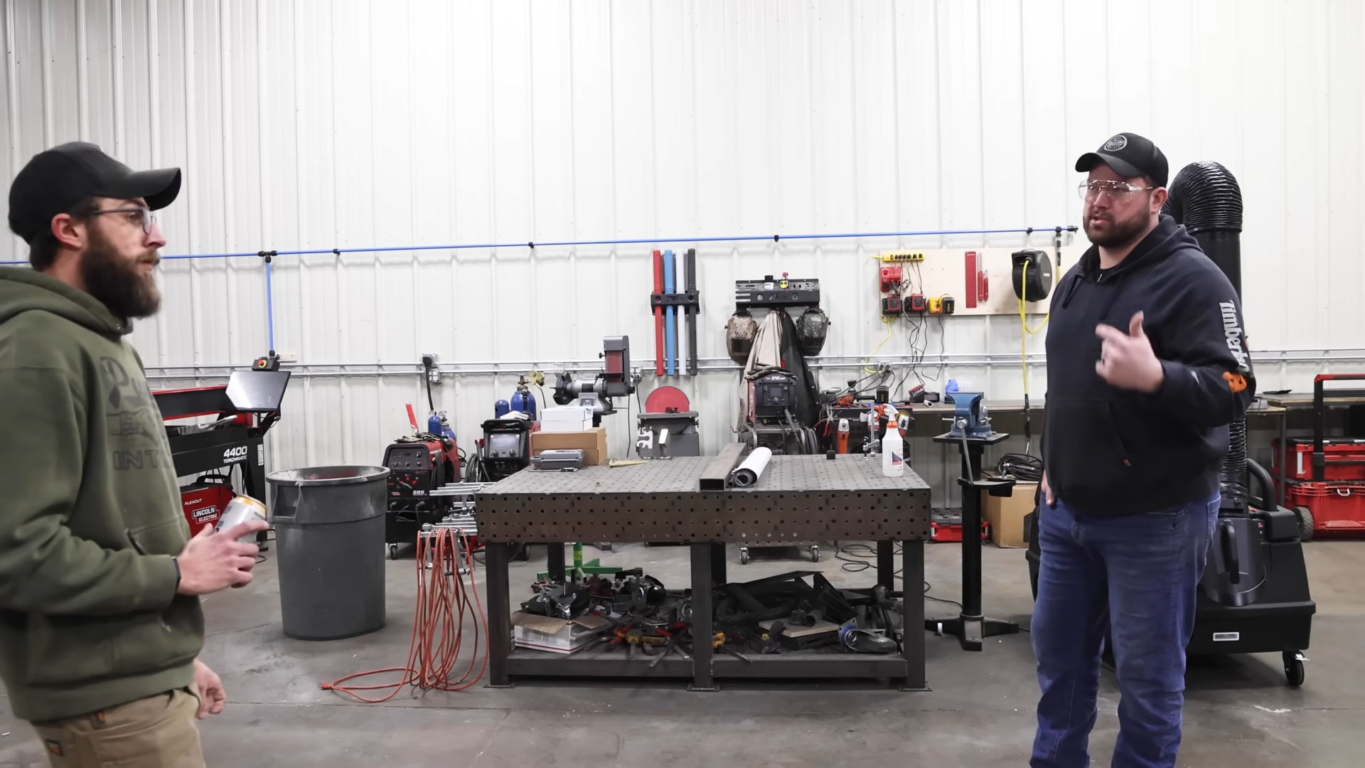 Guy almost dropped a 200lb steel plate on his toes building a metal rack