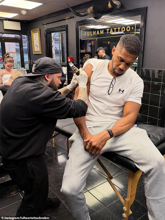 Joshua visited Fulham Tattoo to add his friends' names under the map of Africa on his arm