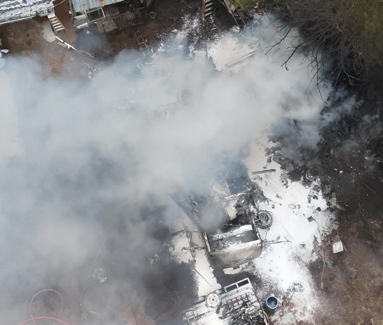 Man displaced after brush fire spreads to camper in Currituck County