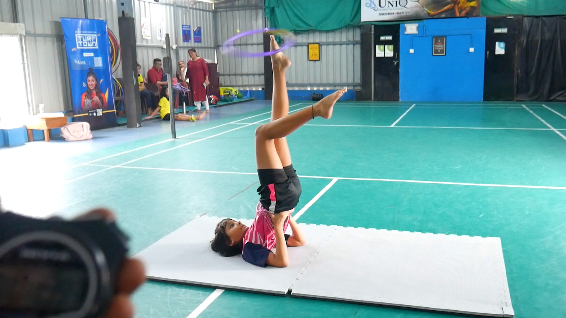 Most hula hoop rotations on the foot in the candle position in 30 ...