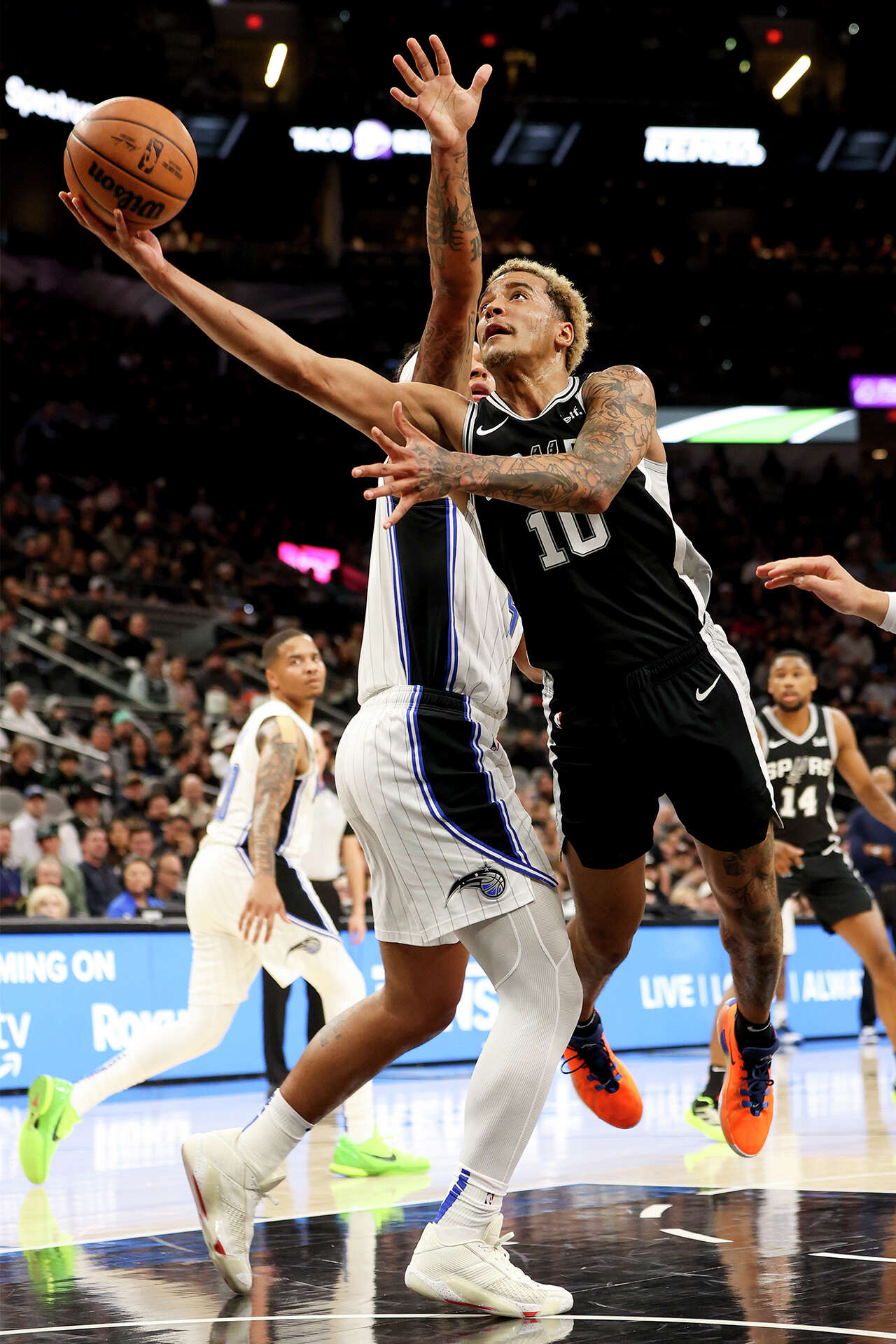 See photos of Jeremy Sochan's colorful time with the Spurs