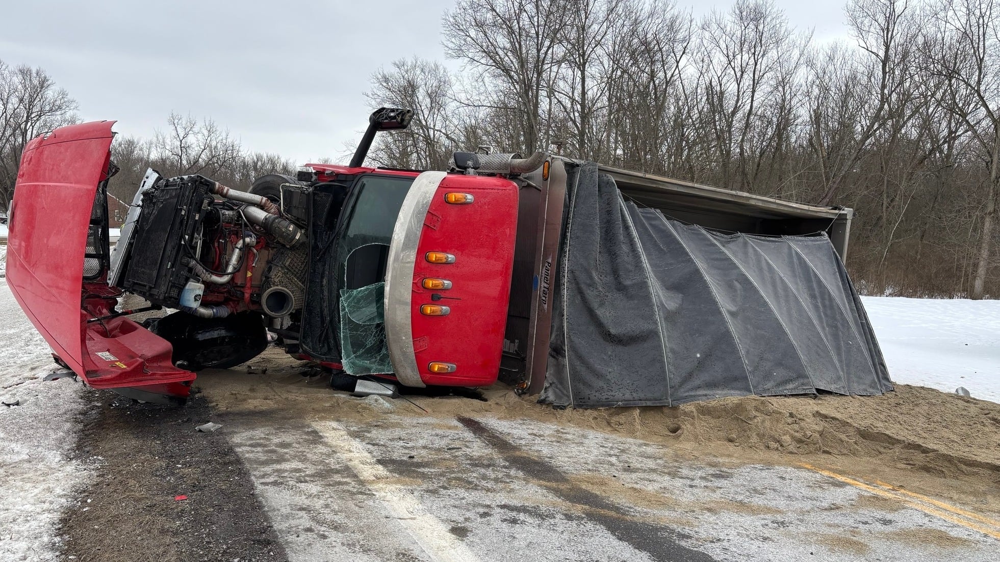 Dump truck overturns after pickup truck collision in Stark County