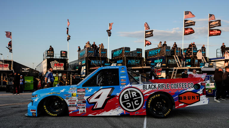 NASCAR Truck driver Garrett Mitchell, better known as "Cleetus McFarland, leaves the garage area for the track during a practice at Daytona International Speedway, Thursday, Feb. 12, 2026, in Daytona Beach, Fla. (AP Photo/Mike Stewart)