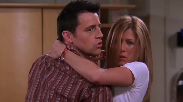 Joey and Rachel looking guilty in the middle of making out on "Friends" (1994-2004)
