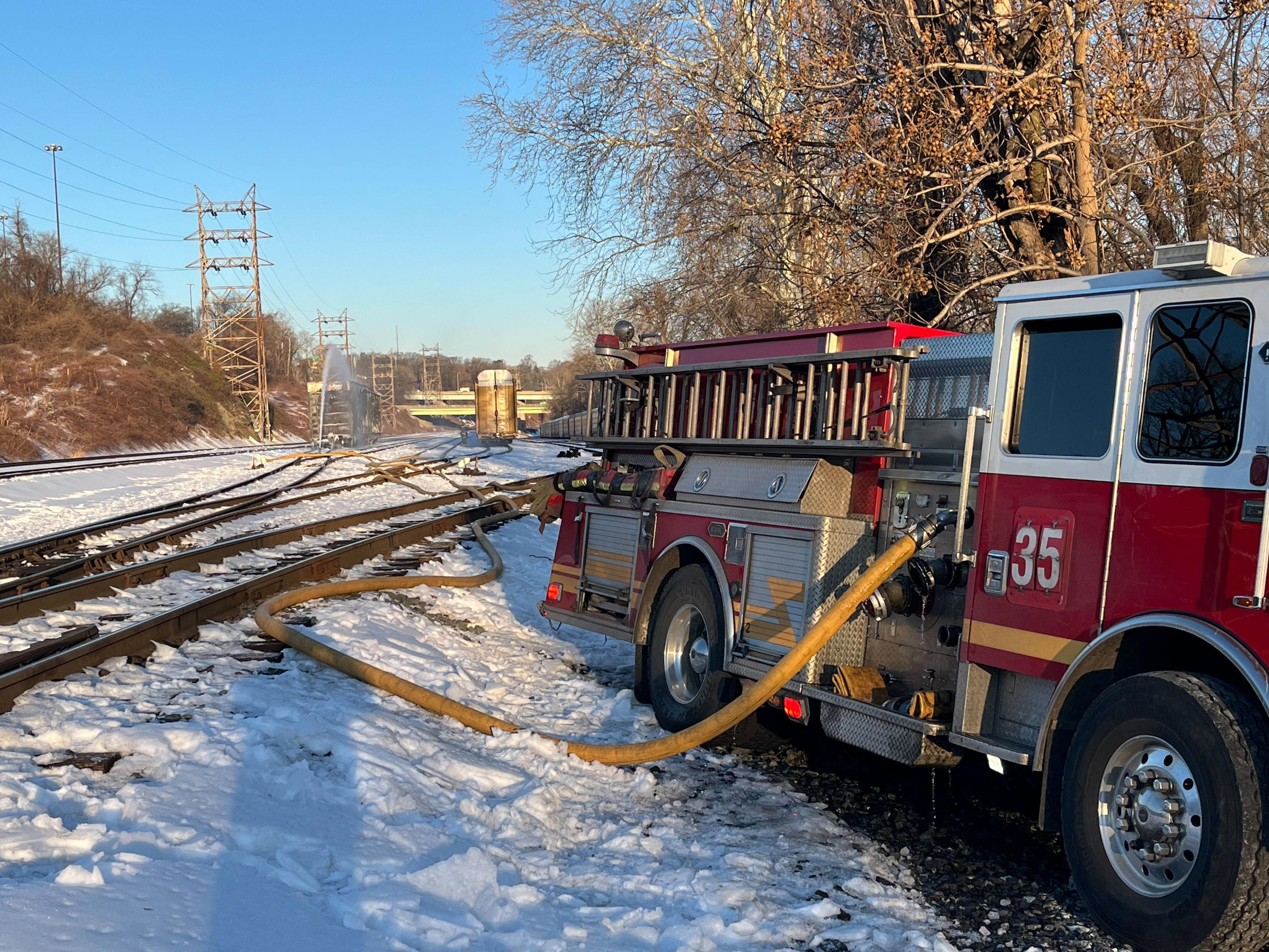 Kelly Drive closed as firefighters work to extinguish freight train fire