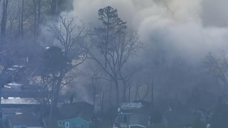 Residents displaced after fire spreads to multiple homes at Gwinnett ...
