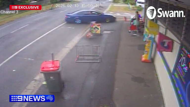 A car skidded and pinned two teenage boys to a wall by a Queensland takeaway shop. 