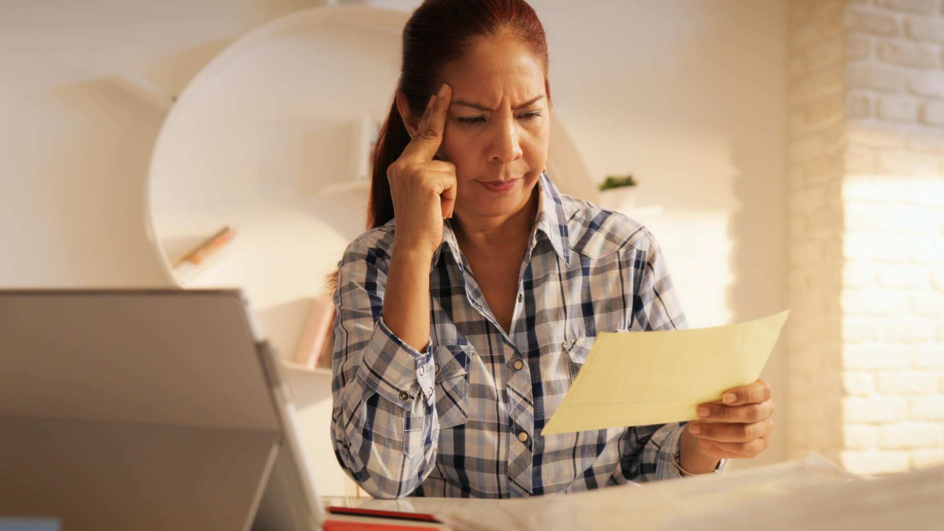 Angry Senior Woman Paying Bills And Filing Federal Tax Return
