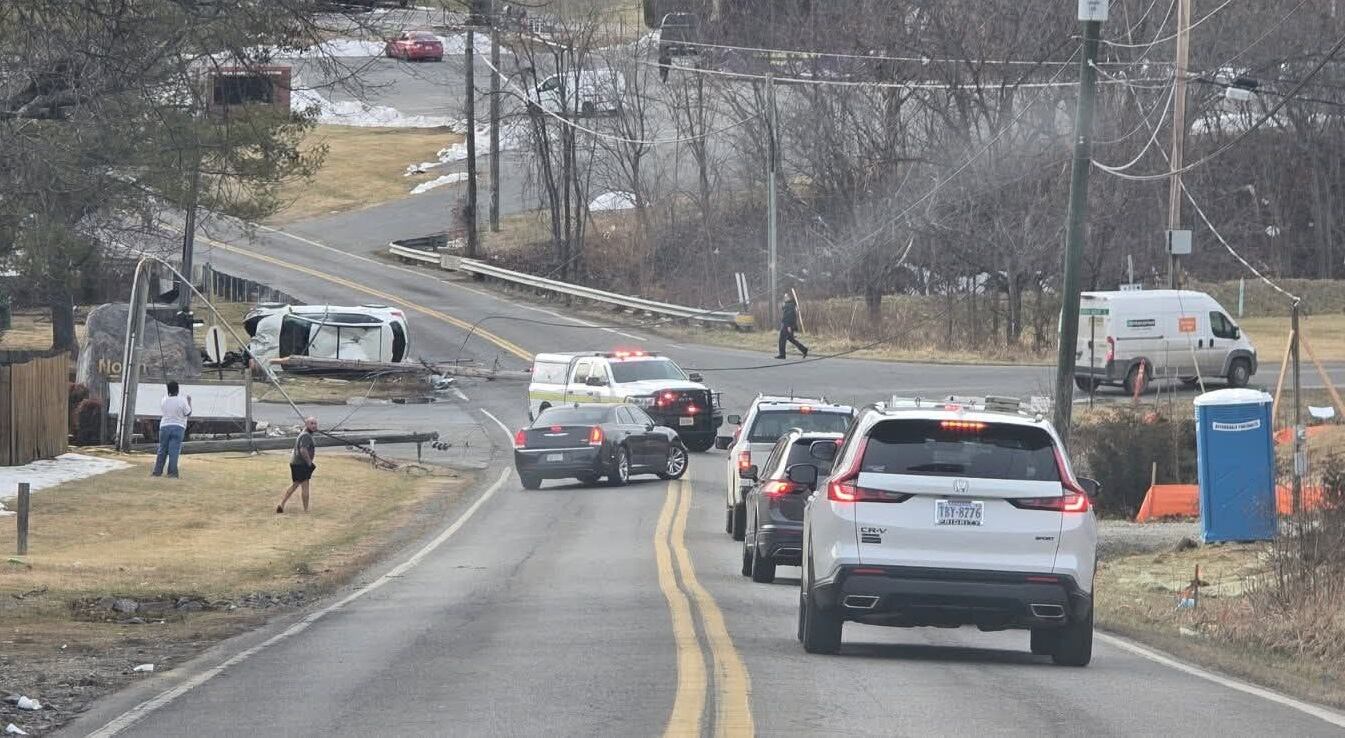 Driver hospitalized after crashing into power pole