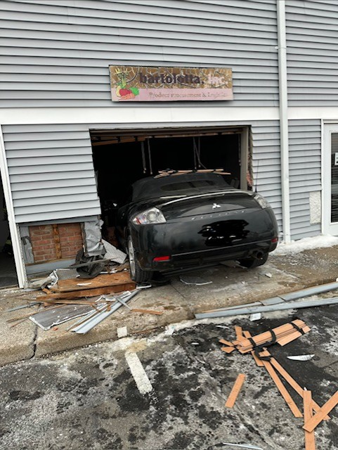 Car causes building damage after crash in Torrington